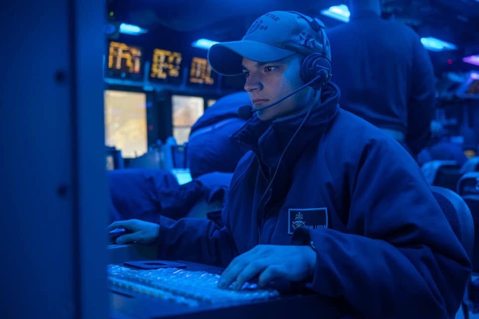 Dylan Little monitoring a command-and-control console aboard USS Antietam